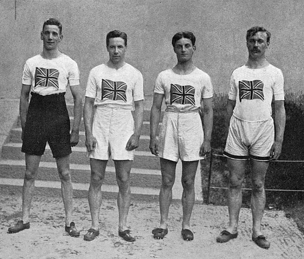 The English 4 x 100 metres relay team who won gold medals at the Stockholm Olympics in 1912. From left to right: D. Jacobs, H. M. Macintosh, W. R. Applegarth and V. D'Arcy. Note the high-waisted shorts and T-shirts emblazoned with a Union Jack. Date: 1912