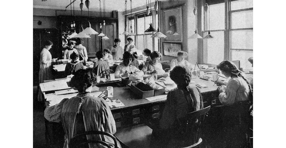The designing room at Raphael Tuck & Sons, fine art publishers of prints, cards, Almanacks and postcards, staffed largely by women. Tuck were one of the leading card and postcard publishers in the 19th and 20th centuries. Date: 1903