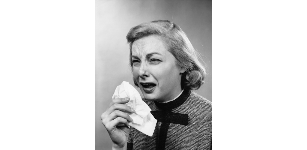 1950s Woman With Handkerchief Sneezing Indoor