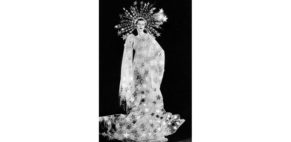 Mrs Charles Sweeny, formerly Miss Margaret Whigham and later the Duchess of Argyll (1912 - 1993), pictured as Astrae, the Star-Maiden for the Olympian Party at Claridges on 5 March 1935 in aid of the Greater London Fund for the Blind. The Olympian Party featured a pageant of Olympians consisting of an entertainment of dancing and singing with orchestral accompaniment. Date: 1935