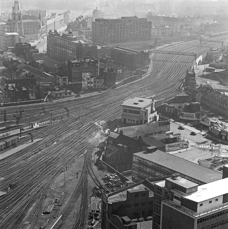Elevated view looking down onto the tracks leading south out of Waterloo Station and showing the surrounding townscape Date: 1960 - 1972