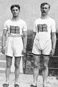 The English 4 x 100 metres relay team who won gold medals at the Stockholm Olympics in 1912. From left to right: D. Jacobs, H. M. Macintosh, W. R. Applegarth and V. D'Arcy. Note the high-waisted shorts and T-shirts emblazoned with a Union Jack. Date: 1912