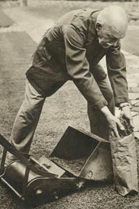 Mr J. R. B. Branson, who advocated a diet of grass to counter food shortages during the Second World War. The Bystander magazine ran a double page spread on him and his views. Picture shows him creating an appetite by mowing the grass and bagging the sweepings ready to take indoors for preparation. Date: 1939