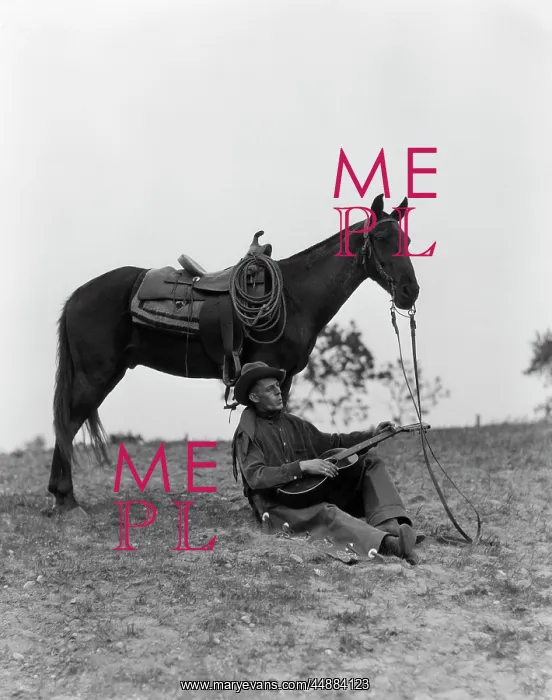  : 1920s 1930s Cowboy Sitting Against
