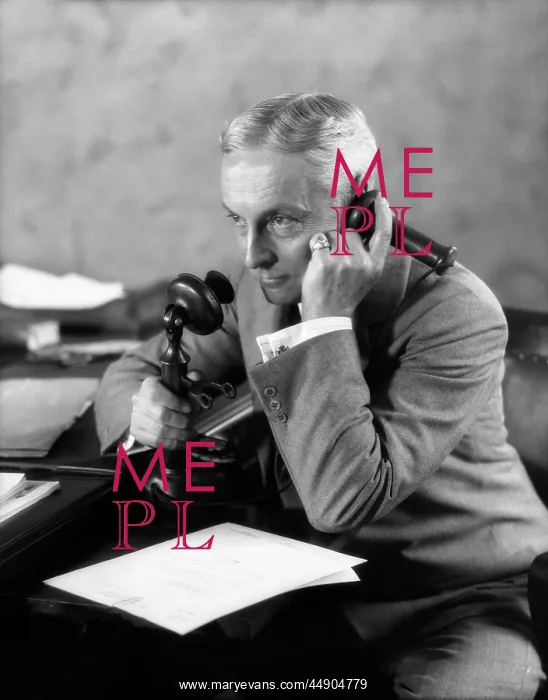 : 1920s Businessman At Desk Talking : 1920s Businessman At Desk Talking