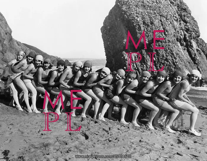 : 1920's line of women spooning on the beach : 1920's line of women spooning on the beach