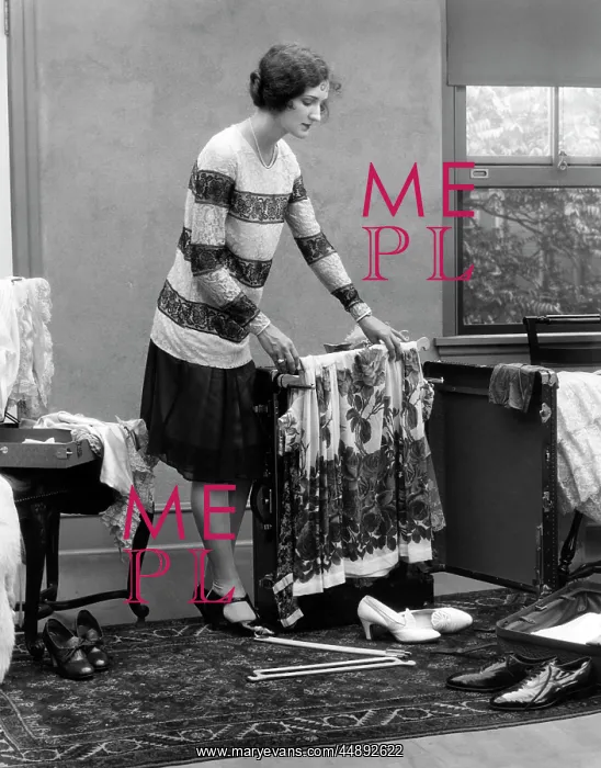  : 1920s Woman Packing Clothes For