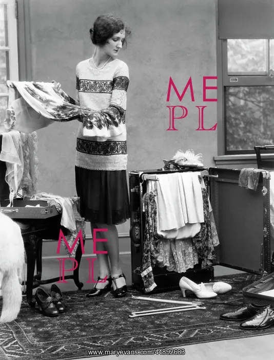  : 1920s Woman Packing Clothes For