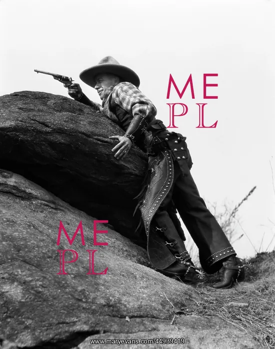  : 1930s Cowboy On Rocks Aiming Gun