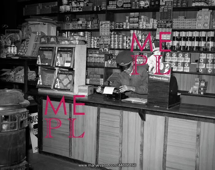 : 1930s MAN BEHIND COUNTER IN GENERAL STORE USING : 1930s MAN BEHIND COUNTER IN GENERAL STORE USING