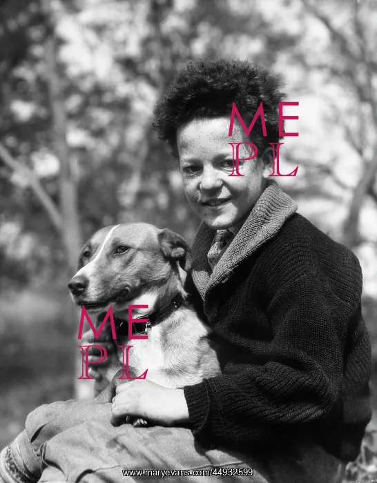 : 1930s - Smiling Boy Looking at Camera Holding Dog : 1930s - Smiling Boy Looking at Camera Holding Dog