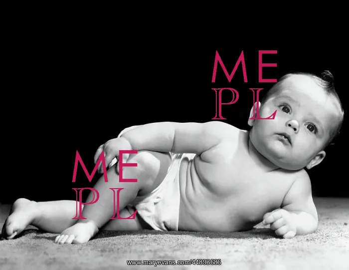: 1940s BABY LAYING ON SIDE PROPPED UP ON ELBOW : 1940s BABY LAYING ON SIDE PROPPED UP ON ELBOW