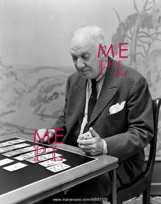  : 1940s Elderly Man Playing Solitaire