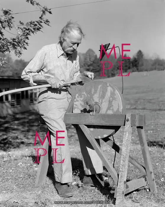 : 1940s Elderly Man Seated At Grindstone : 1940s Elderly Man Seated At Grindstone