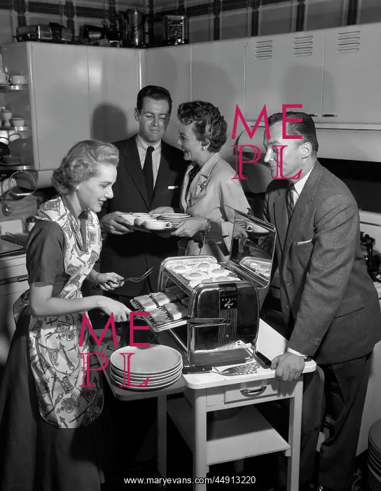  : 1950s 2 COUPLES IN KITCHEN WOMAN COOKING HAM