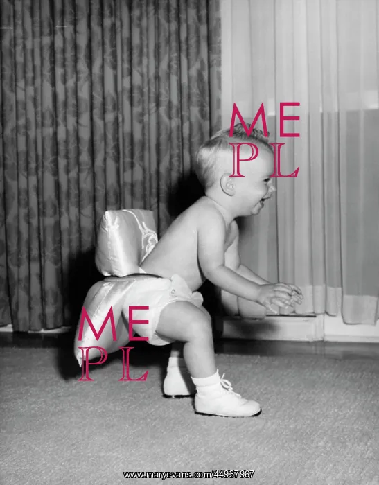 : 1950s Baby Learning To Walk Wearing : 1950s Baby Learning To Walk Wearing