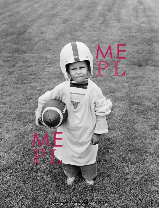  : 1950s BOY STANDING IN GRASS WEARING OVERSIZED
