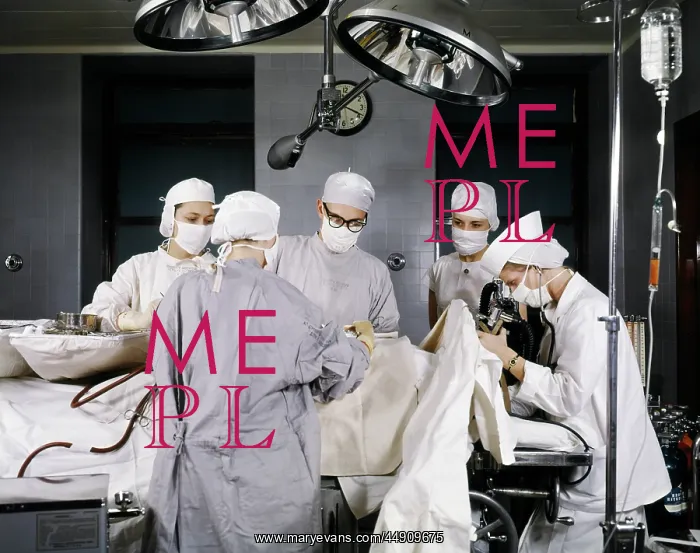 : 1950s hospital operating room surgery in progress : 1950s hospital operating room surgery in progress