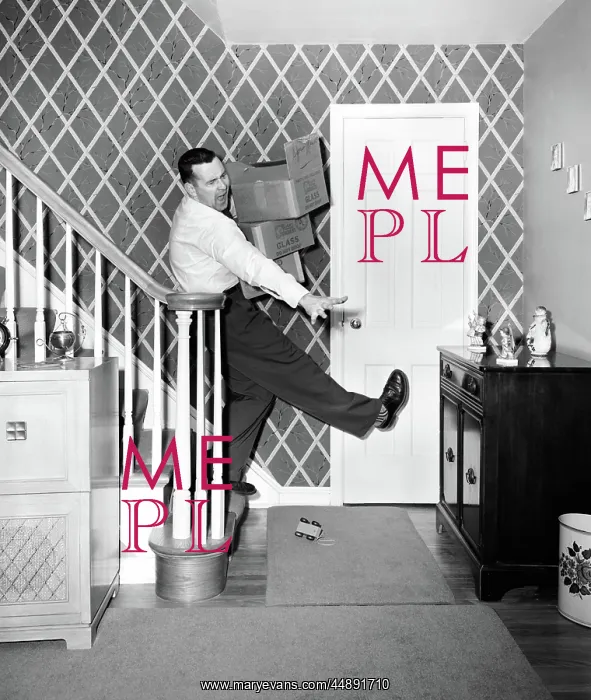 : 1950s MAN CARRYING STORAGE BOXES DOWN STAIRS : 1950s MAN CARRYING STORAGE BOXES DOWN STAIRS