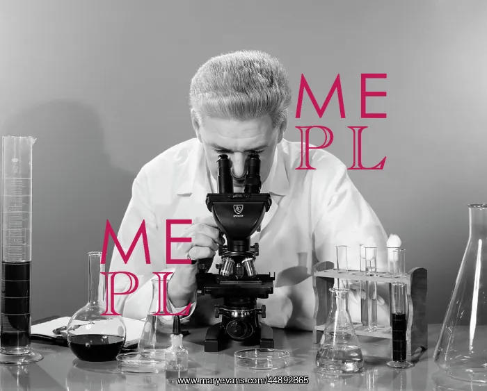 : 1950s Man In Lab Coat Sitting : 1950s Man In Lab Coat Sitting