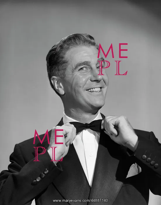 : 1950s Man Smiling In Tuxedo Pulling