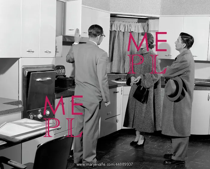 : 1950s Salesman In Model Kitchen : 1950s Salesman In Model Kitchen