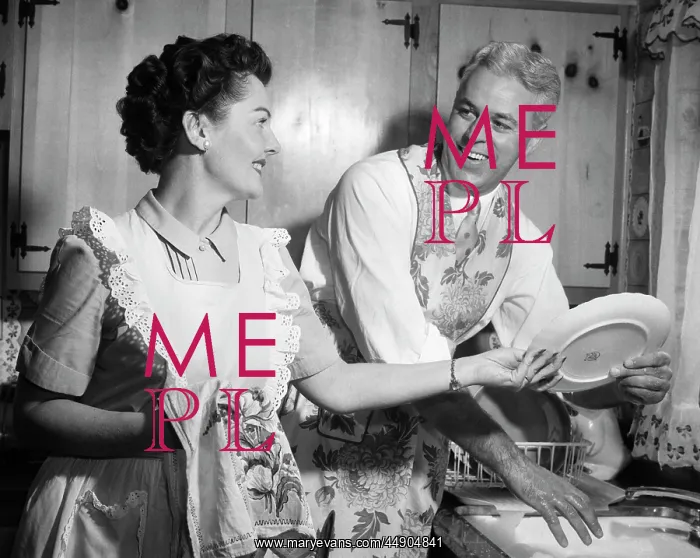 : 1950s - Smiling Husband in Apron in Kitchen Washing Dishes : 1950s - Smiling Husband in Apron in Kitchen Washing Dishes