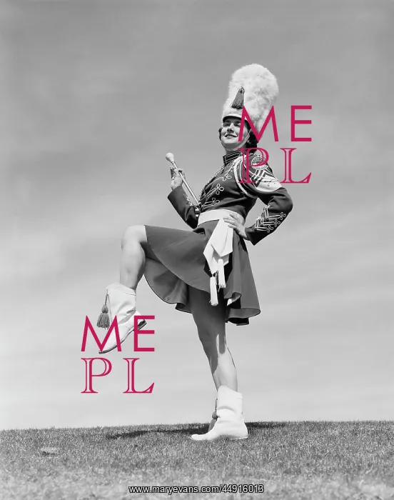 : 1950s SMILING MAJORETTE POSING OUTDOORS WEARING : 1950s SMILING MAJORETTE POSING OUTDOORS WEARING