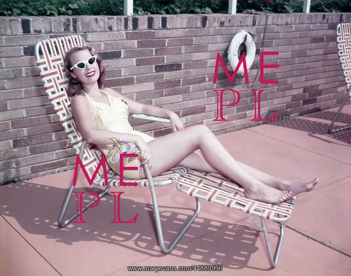 : 1950s Smiling Woman Sun Bathing : 1950s Smiling Woman Sun Bathing