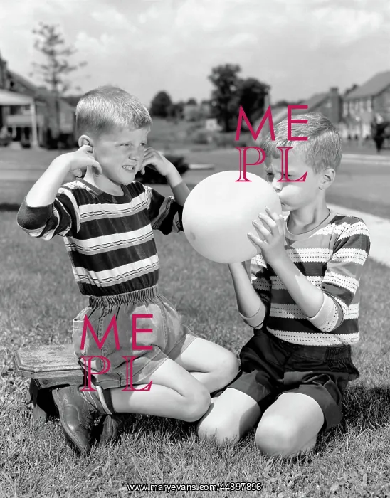 : 1950s TWO YOUNG BOYS ONE BLOWING UP BALLOON ONE : 1950s TWO YOUNG BOYS ONE BLOWING UP BALLOON ONE