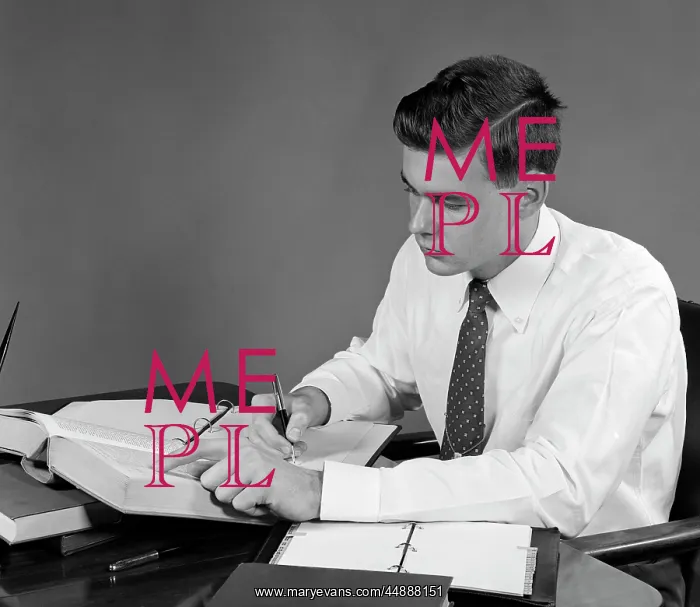  : 1950s Young Man Sitting At Desk