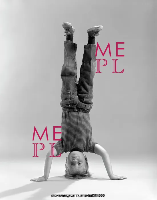 : 1960s Boy Standing on his Head looking at Camera : 1960s Boy Standing on his Head looking at Camera