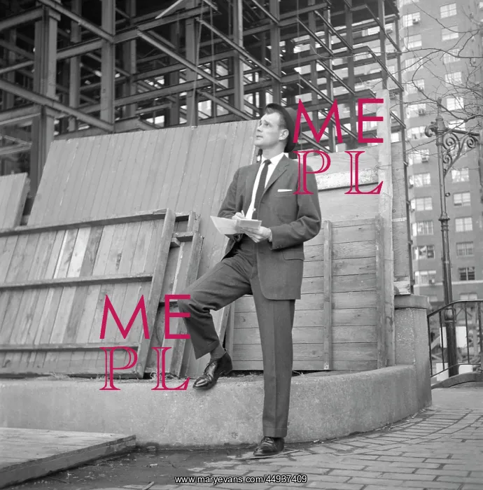 : 1960s Businessman On Curb Looking : 1960s Businessman On Curb Looking