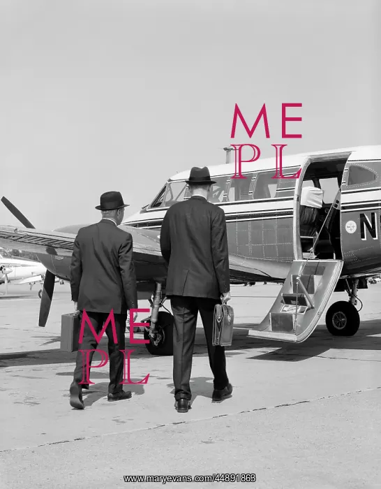 : 1960s TWO BUSINESSMEN WALKING TOGETHER TO A SMALL : 1960s TWO BUSINESSMEN WALKING TOGETHER TO A SMALL