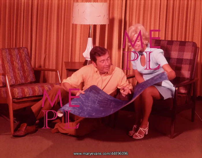  : 1960s Couple Holding Blueprints