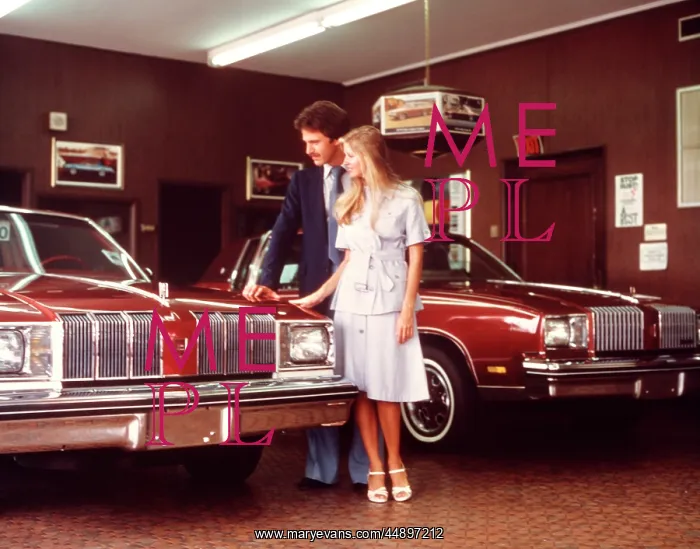 : 1960s Couple Looking At Car In : 1960s Couple Looking At Car In