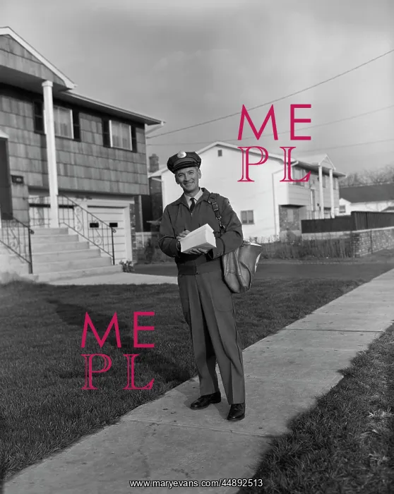 : 1960s MAILMAN WALKING OUTSIDE CARRYING MAIL ON : 1960s MAILMAN WALKING OUTSIDE CARRYING MAIL ON