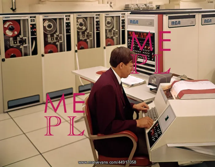 : 1960s Man Programmer Entering Data on System Console Keyb : 1960s Man Programmer Entering Data on System Console Keyb