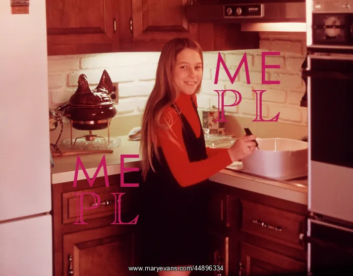  : 1960s Young Girl Cooking In Kitchen