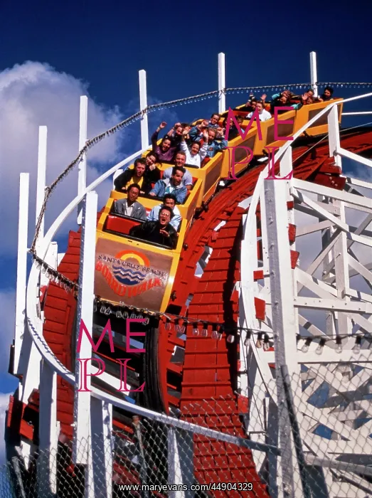 : 1970s 1980s ROLLER COASTER COMING AROUND DOWNHILL : 1970s 1980s ROLLER COASTER COMING AROUND DOWNHILL