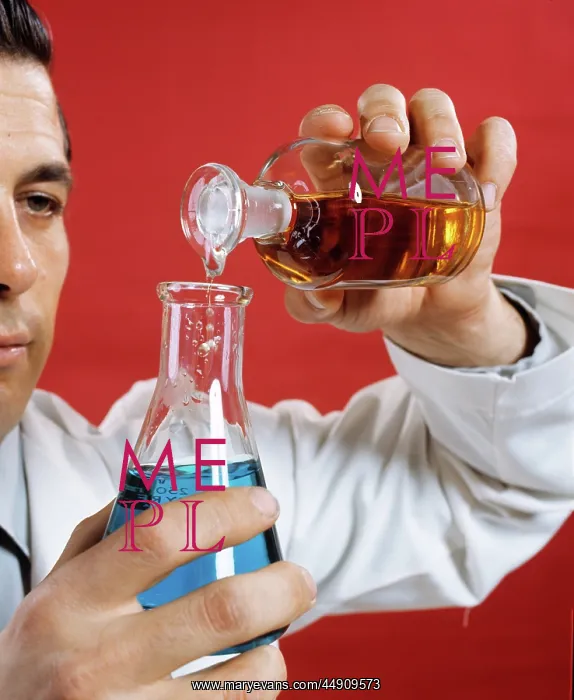 : 1970s Lab Worker Man Pouring Liquid From Bottle Into Flask : 1970s Lab Worker Man Pouring Liquid From Bottle Into Flask