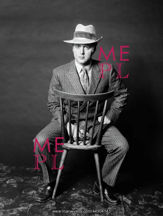 : 1970s - Man Seated Backwards on Chair Looking at Camera : 1970s - Man Seated Backwards on Chair Looking at Camera