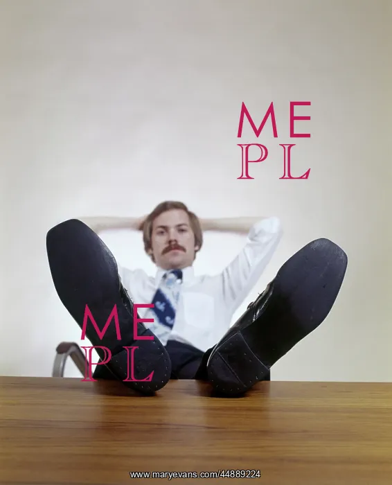 : 1970s Man Sitting With Feet Up : 1970s Man Sitting With Feet Up