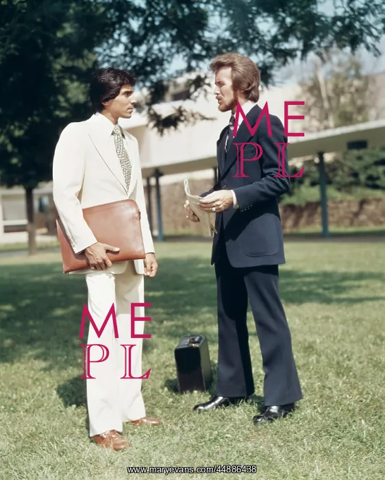 : 1970s Two Men Salesmen Standing : 1970s Two Men Salesmen Standing
