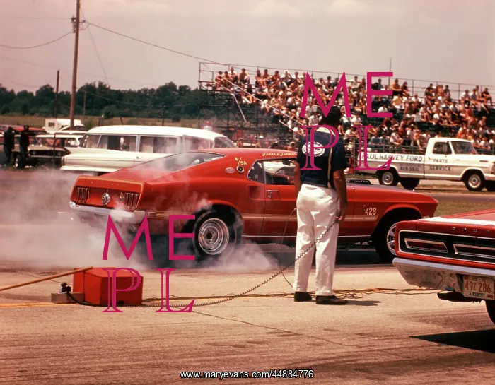 : 1970s Pit Mechanic By Race Car : 1970s Pit Mechanic By Race Car