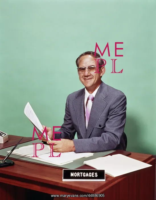  : 1970s Smiling Man At Desk With