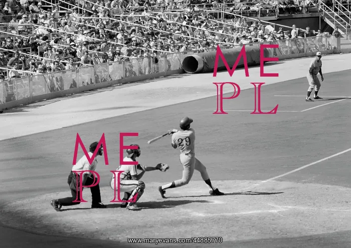 : 1970s Side View Of Batter Completing : 1970s Side View Of Batter Completing
