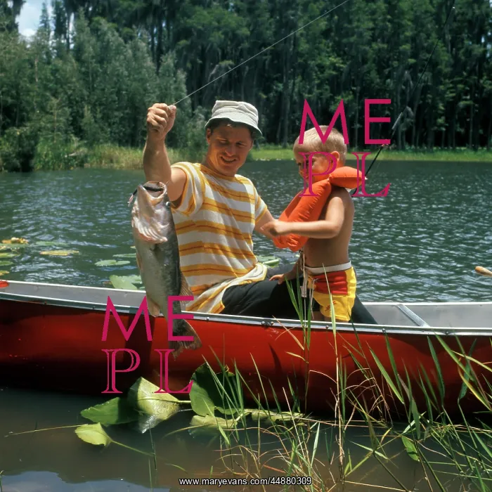 : 1980s Father & Son In Canoe Holding : 1980s Father & Son In Canoe Holding