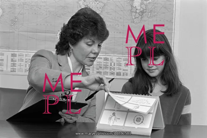 : 1980s Grade School Teacher Holding : 1980s Grade School Teacher Holding
