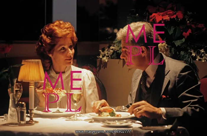 : 1980s middle aged couple dining romantic : 1980s middle aged couple dining romantic